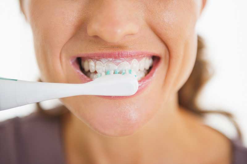 a patient maintaining oral health to prevent gum disease