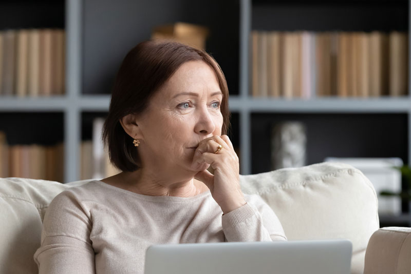 Dental Patient Wondering If She Should Get Dental Implants Or Dentures in Houston, TX