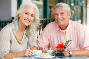 Dental Implant Patients Eating Together With Their False Teeth in Houston, TX