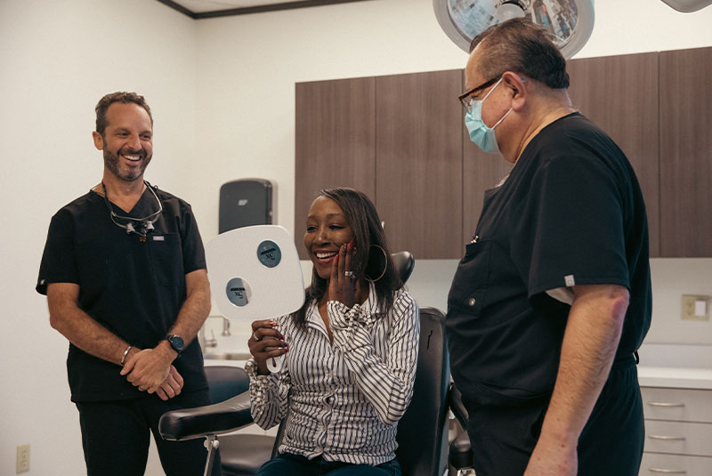 dental implant patient smiling after procedure